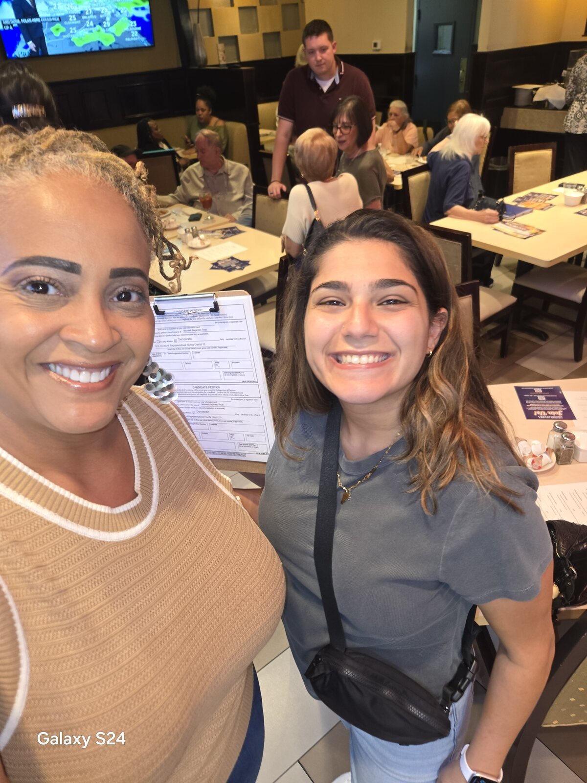 Gloria Joyner with a community member at a neighborhood gathering