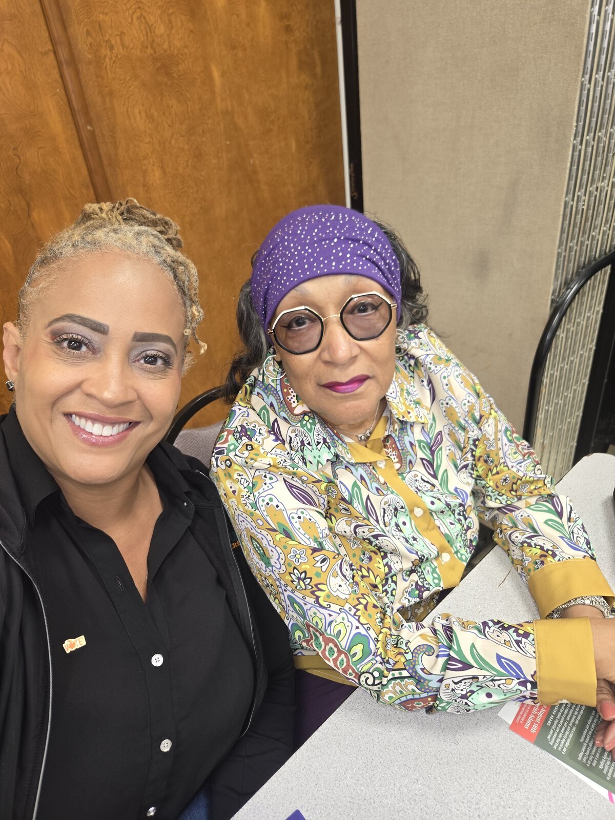 Gloria Joyner visiting with a senior resident